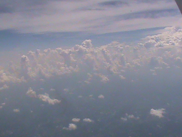 ended up getting the seat facing away from the city so check these clouds instead photo of clouds outside plane
